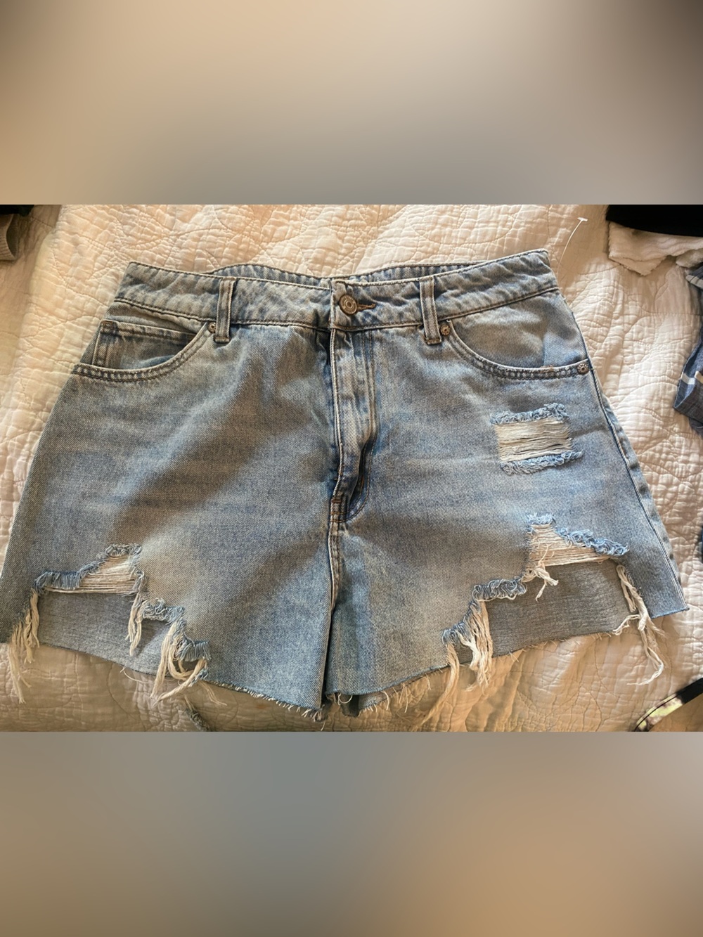 Distressed denim shorts